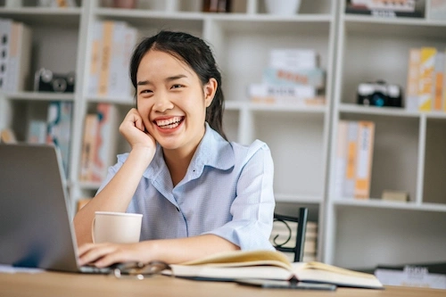 a young woman studies bachelor's degree online from UK university with Douglas Business School Singapore